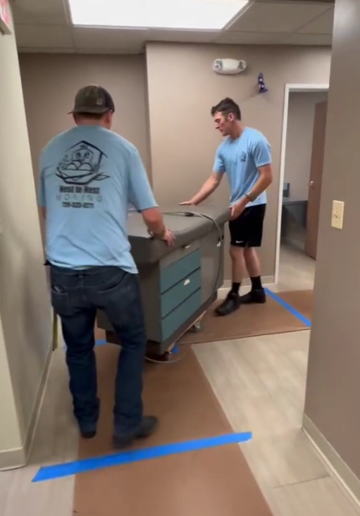 A large apartment building with lots of balconies and windows.