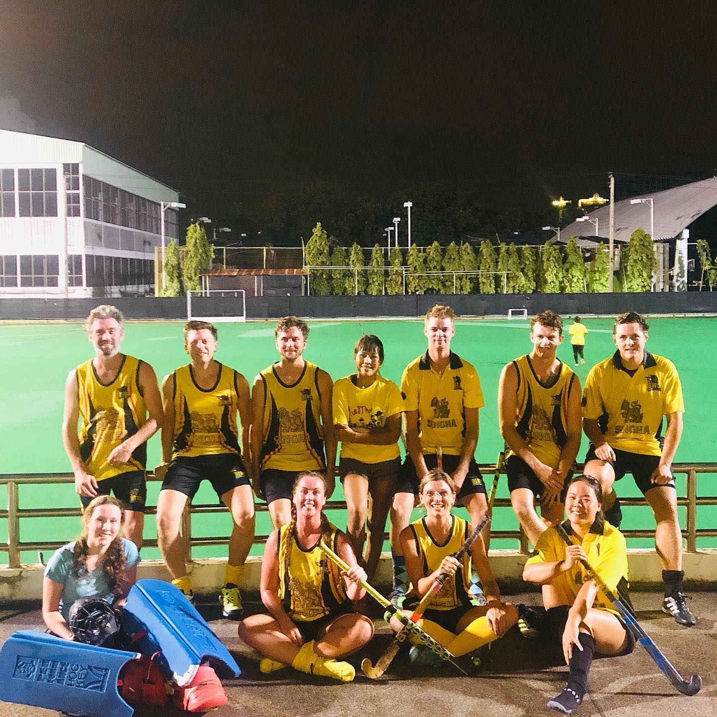 A group of hockey players are posing for a picture