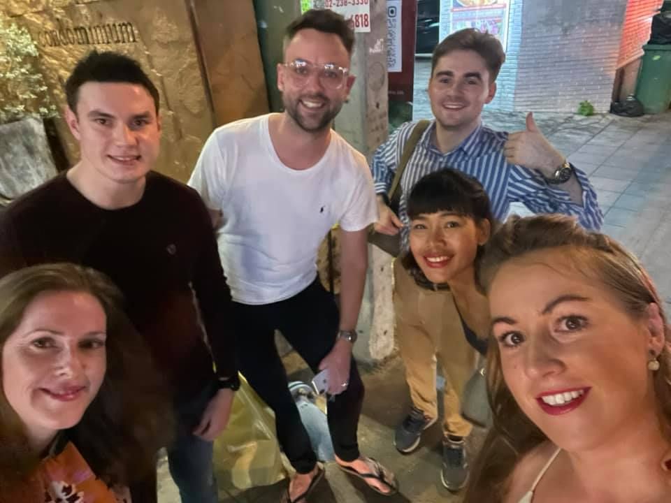 A group of people are posing for a picture together.