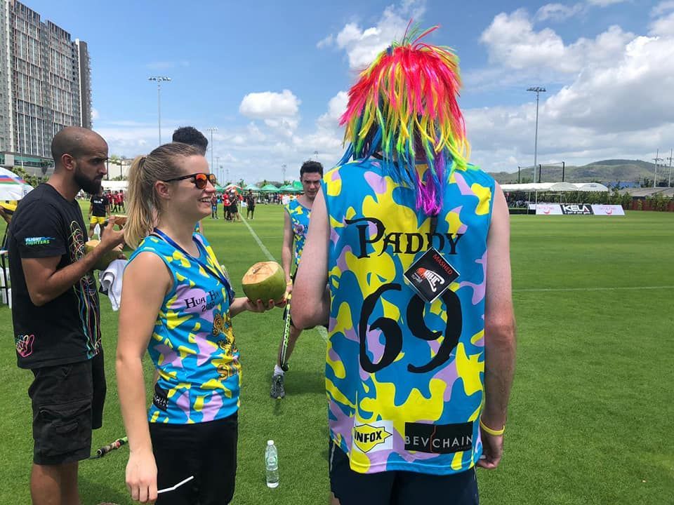 A man wearing a camouflage vest with the number 69 on it
