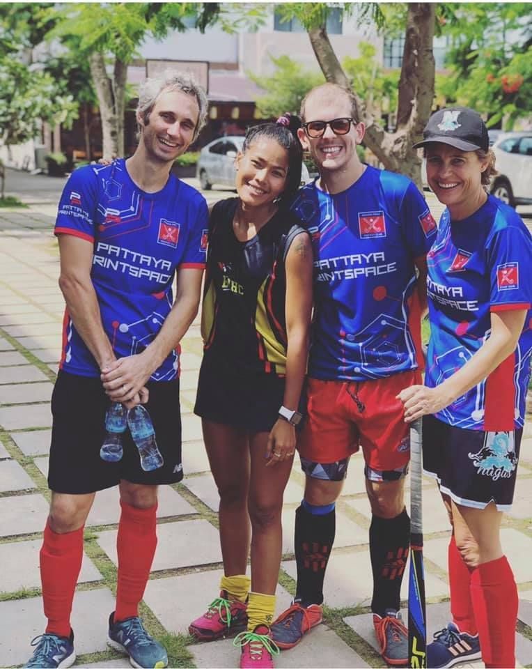 A group of hockey players are posing for a picture