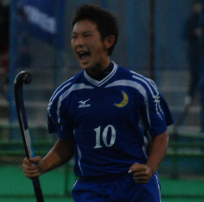 A man wearing a blue shirt with the number 10 on it