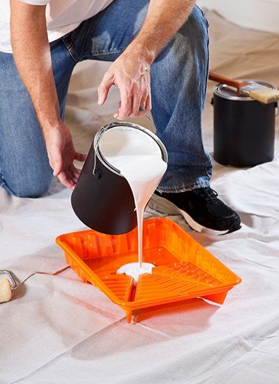 Painter Pouring Paint on the Tray | Finksburg, MD | Handyman On Call LLC