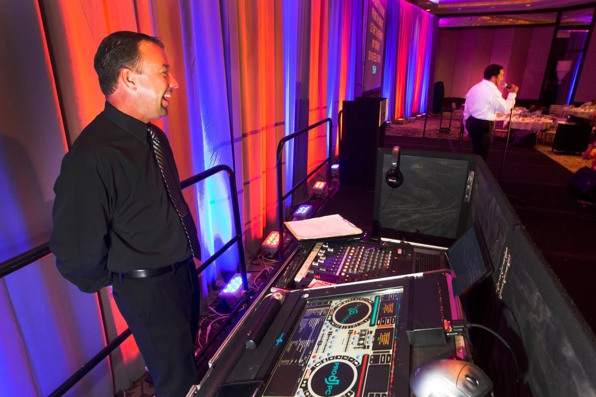 pj the dj at a show with uplighting