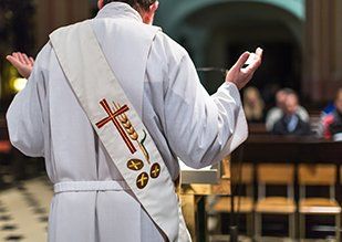 Priest conducting Mass in Church in Metairie, LA