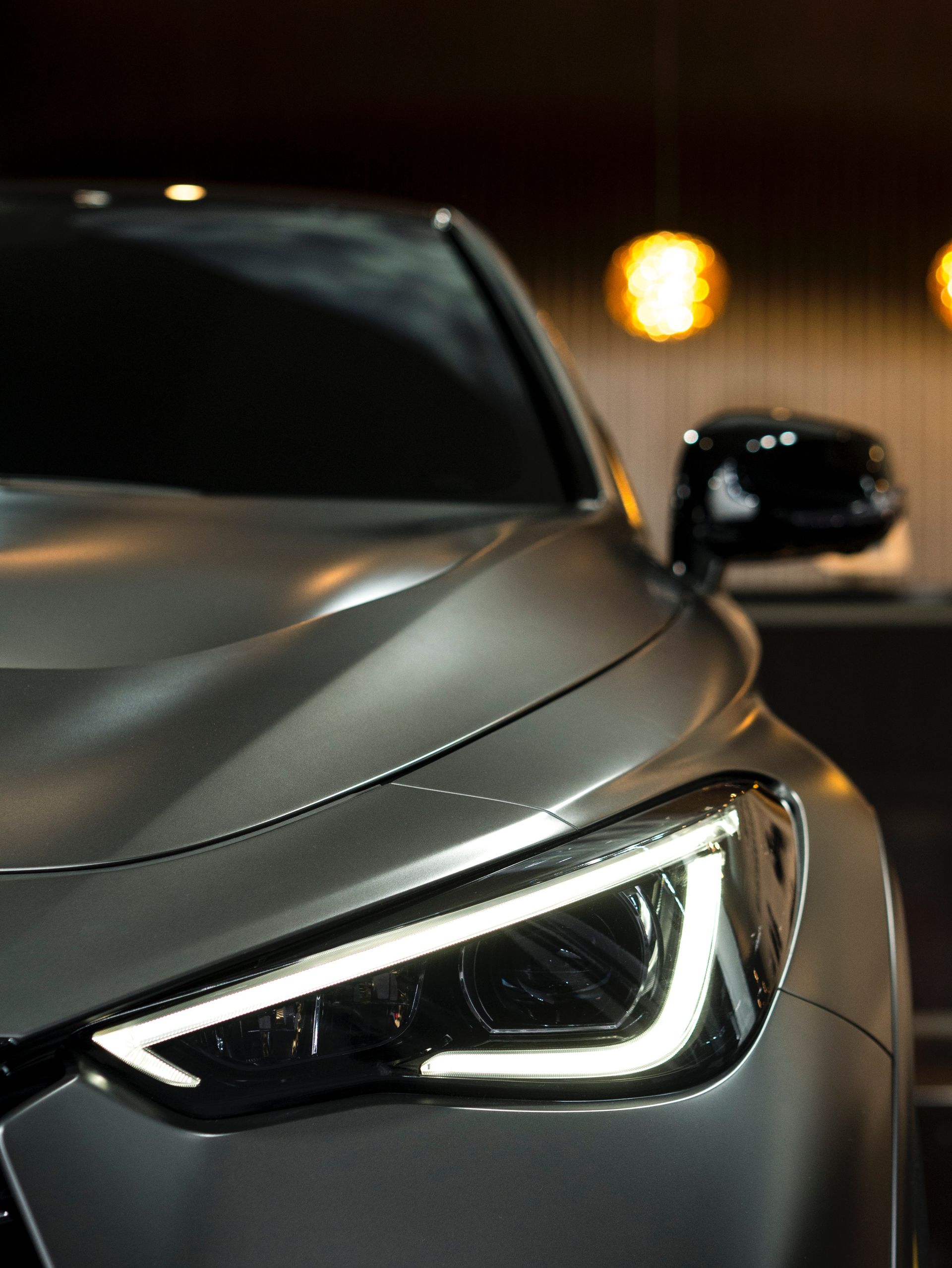 A close up of a car 's headlight at night