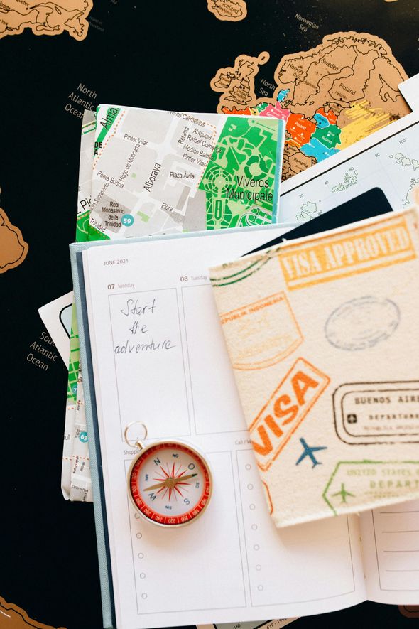 Passport, map, and compass on a world map. Travel concept with 
