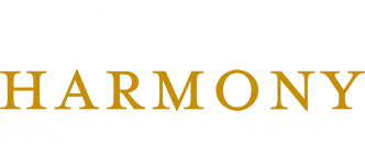 Gold “HARMONY” text on a white background