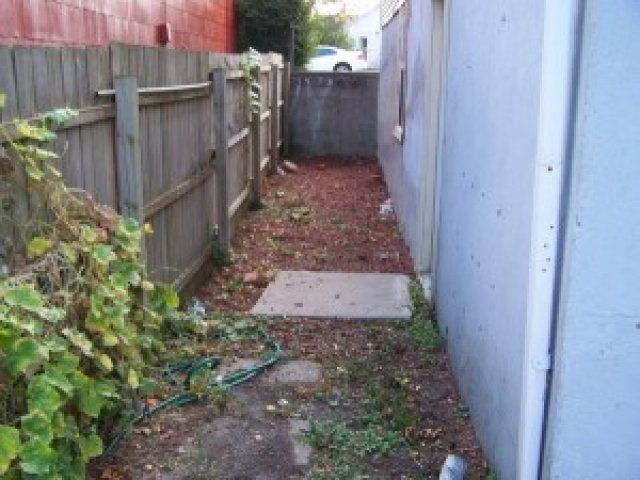 Side yard of 3418 Jackson St | DiBar Enterprises