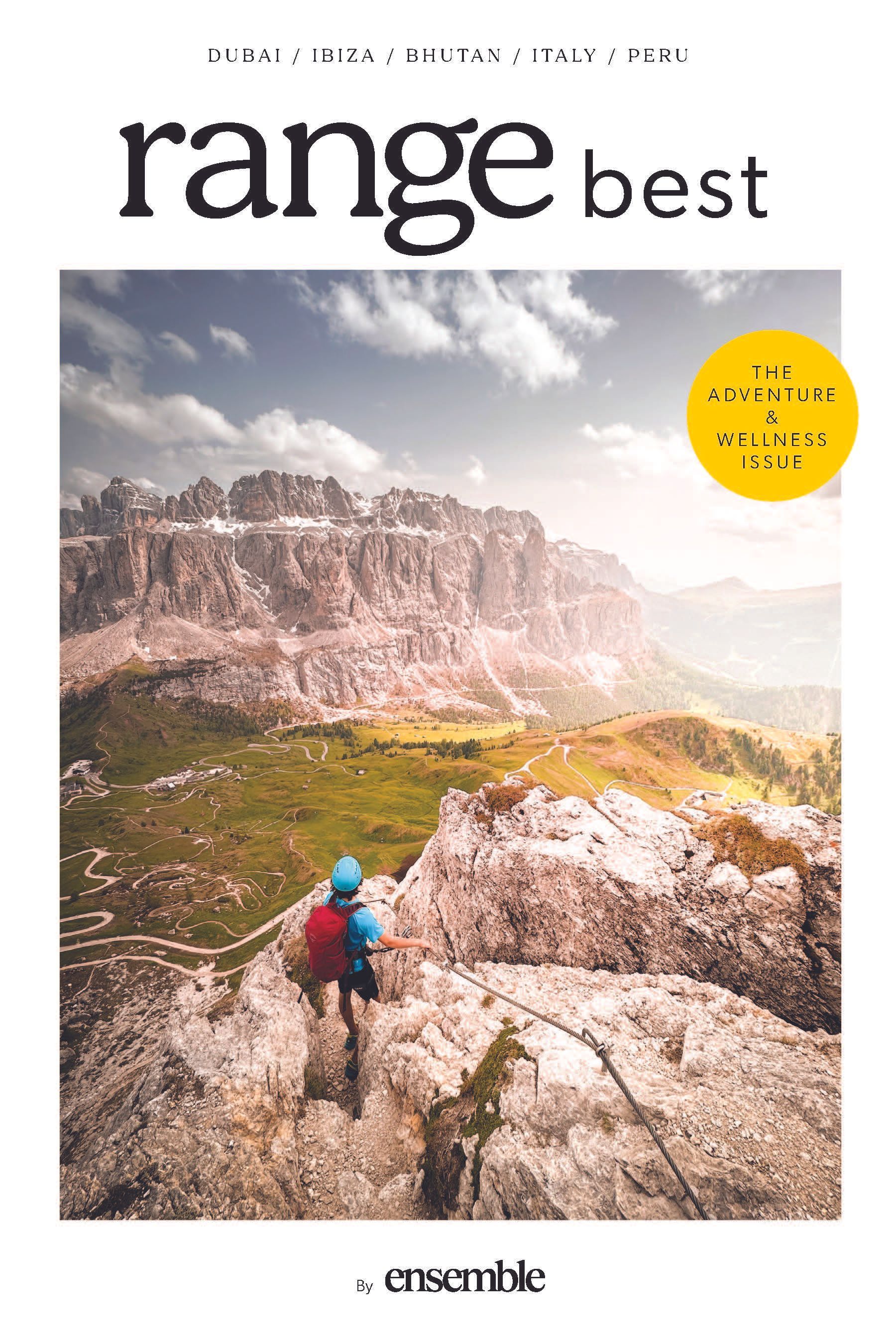 A person is standing on top of a rocky mountain.