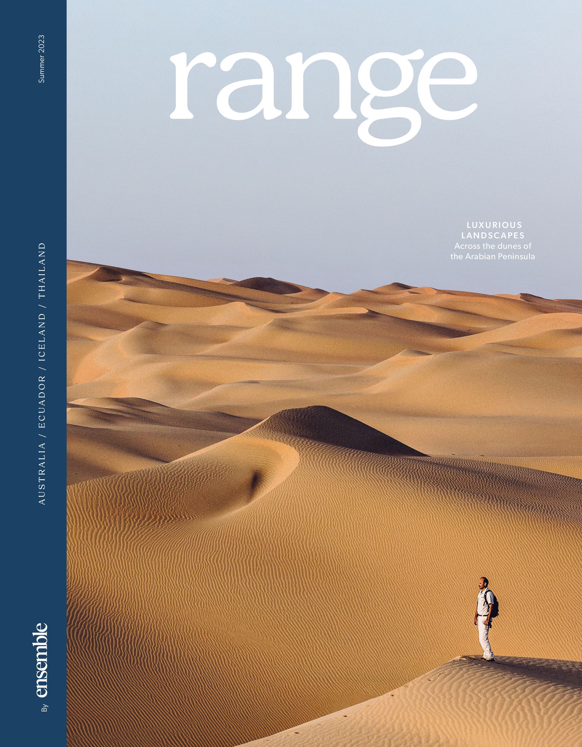 A man is standing in the middle of a desert on the cover of a magazine.