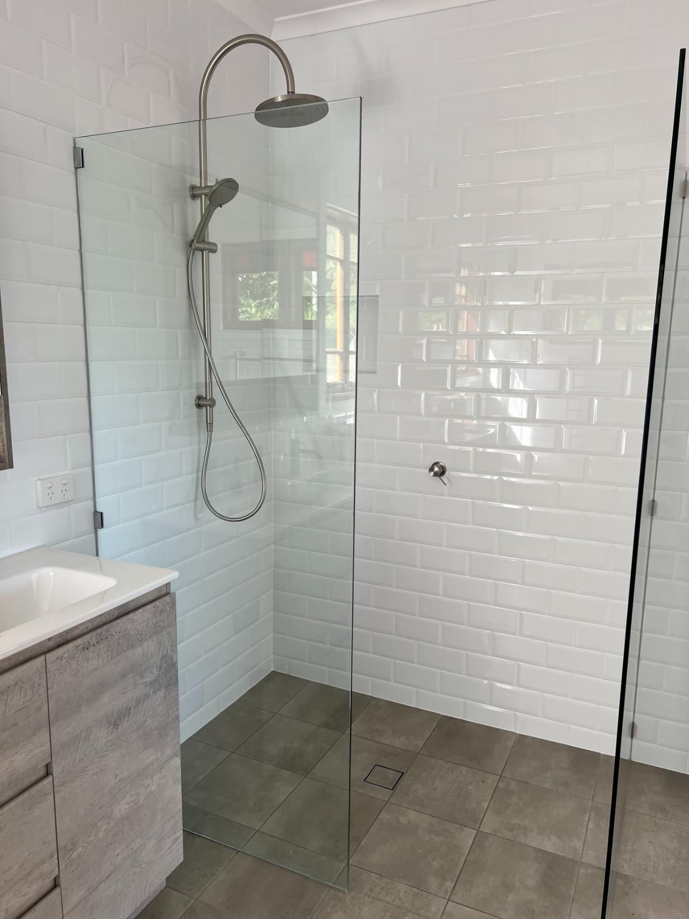A Bathroom With A Walk In Shower And A Sink — Etosha Plumbing & Gasfitting In Lismore, NSW