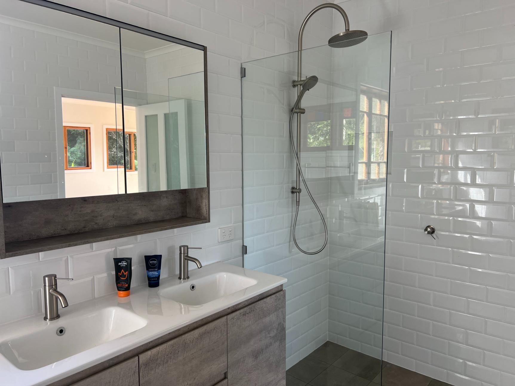 A Bathroom With Two Sinks And A Walk In Shower — Etosha Plumbing & Gasfitting In Alstonville, NSW