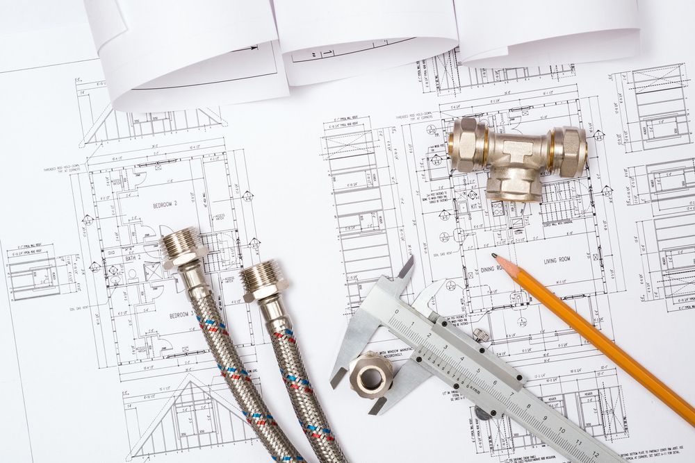 A Plumbing Drawing With A Pencil, Caliper, And Valves On It — Etosha Plumbing & Gasfitting In Byron Bay, NSW