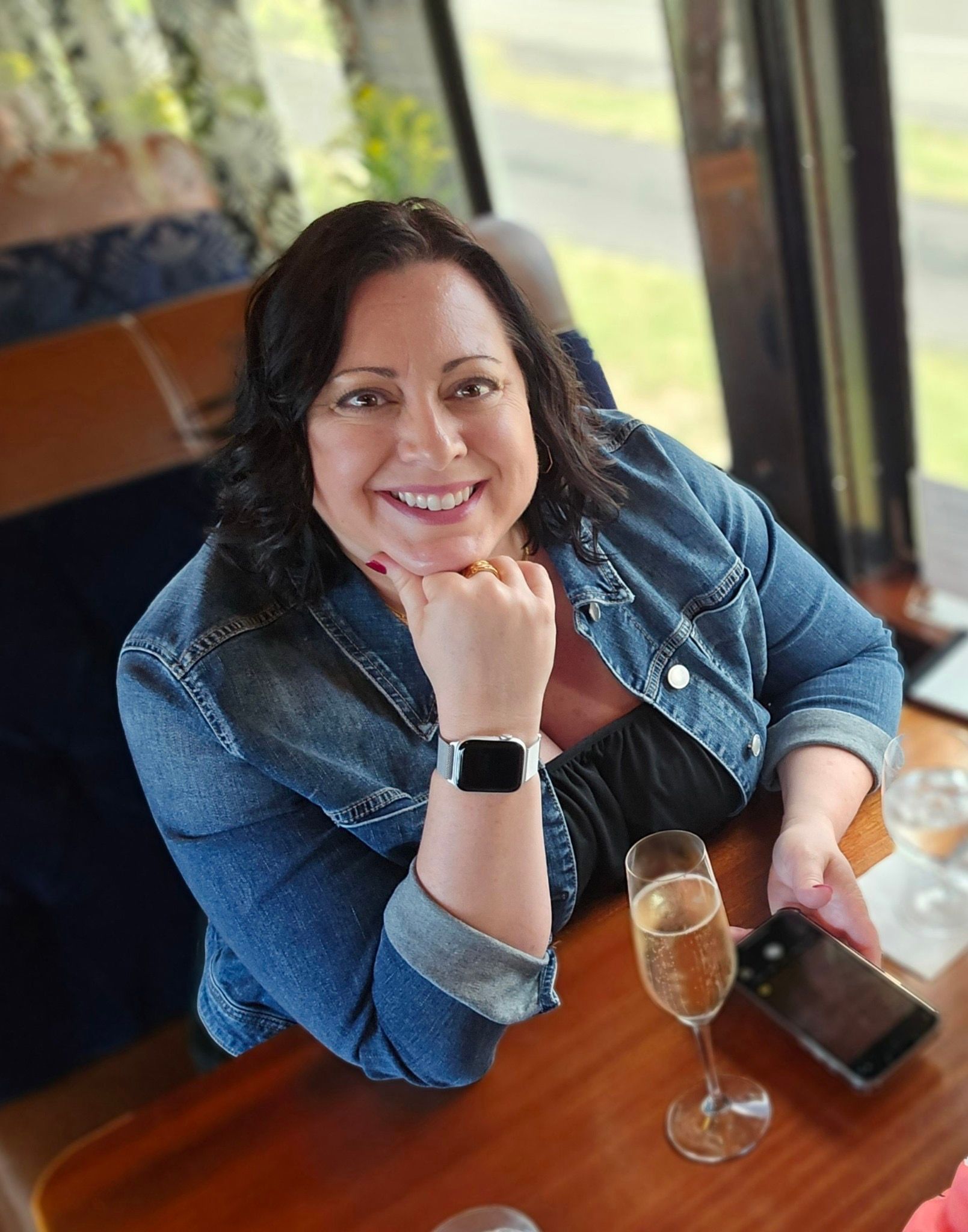 Amy, owner of Sights To See Travel, smiling warmly, showcasing her passion for travel and personalized service.