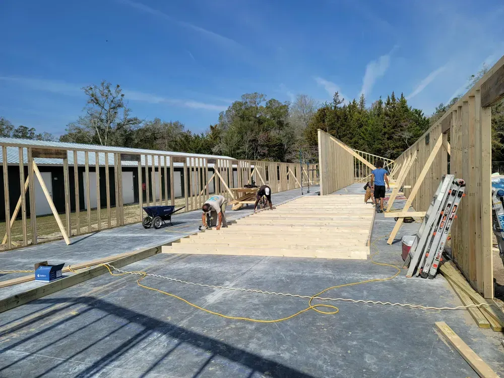A group of people are working on a building under construction.