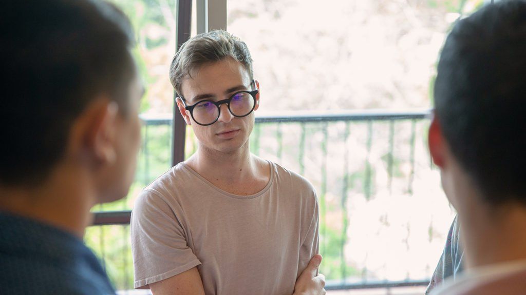 Several persons participating in a conversation