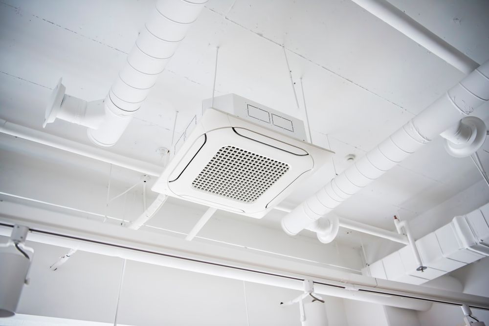 White Industrial Ceiling With Exposed Ducts — OHMY Electrical Contractors in Carina, QLD