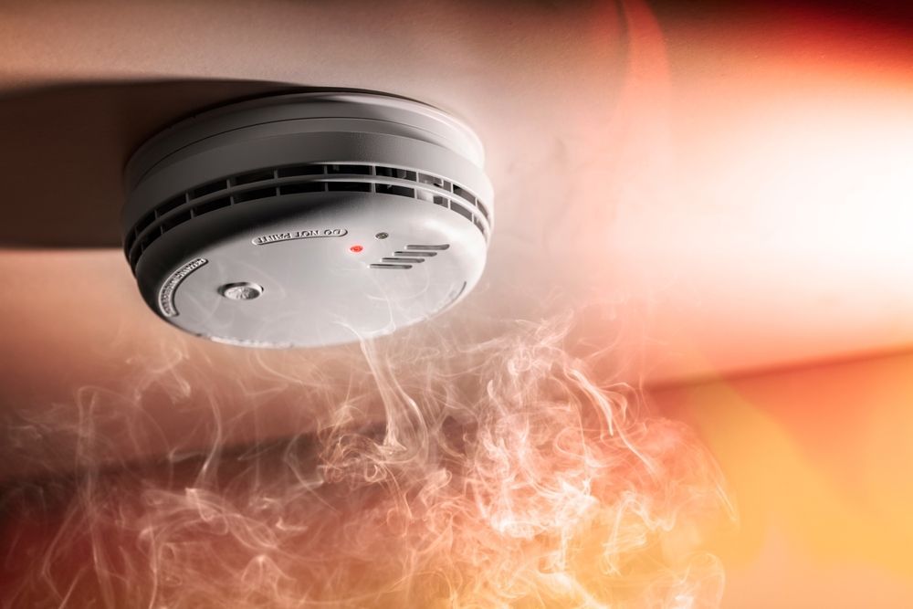 A White Smoke Detector Mounted on a Ceiling — OHMY Electrical Contractors in Carina, QLD
