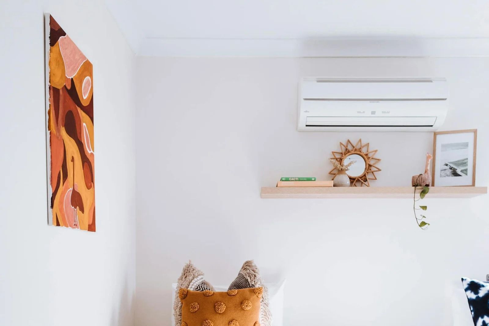 A White Room Featuring a Wall-mounted Ac Unit — OHMY Electrical Contractors in Carina, QLD