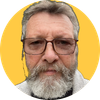 A man with glasses and a beard is in a yellow circle