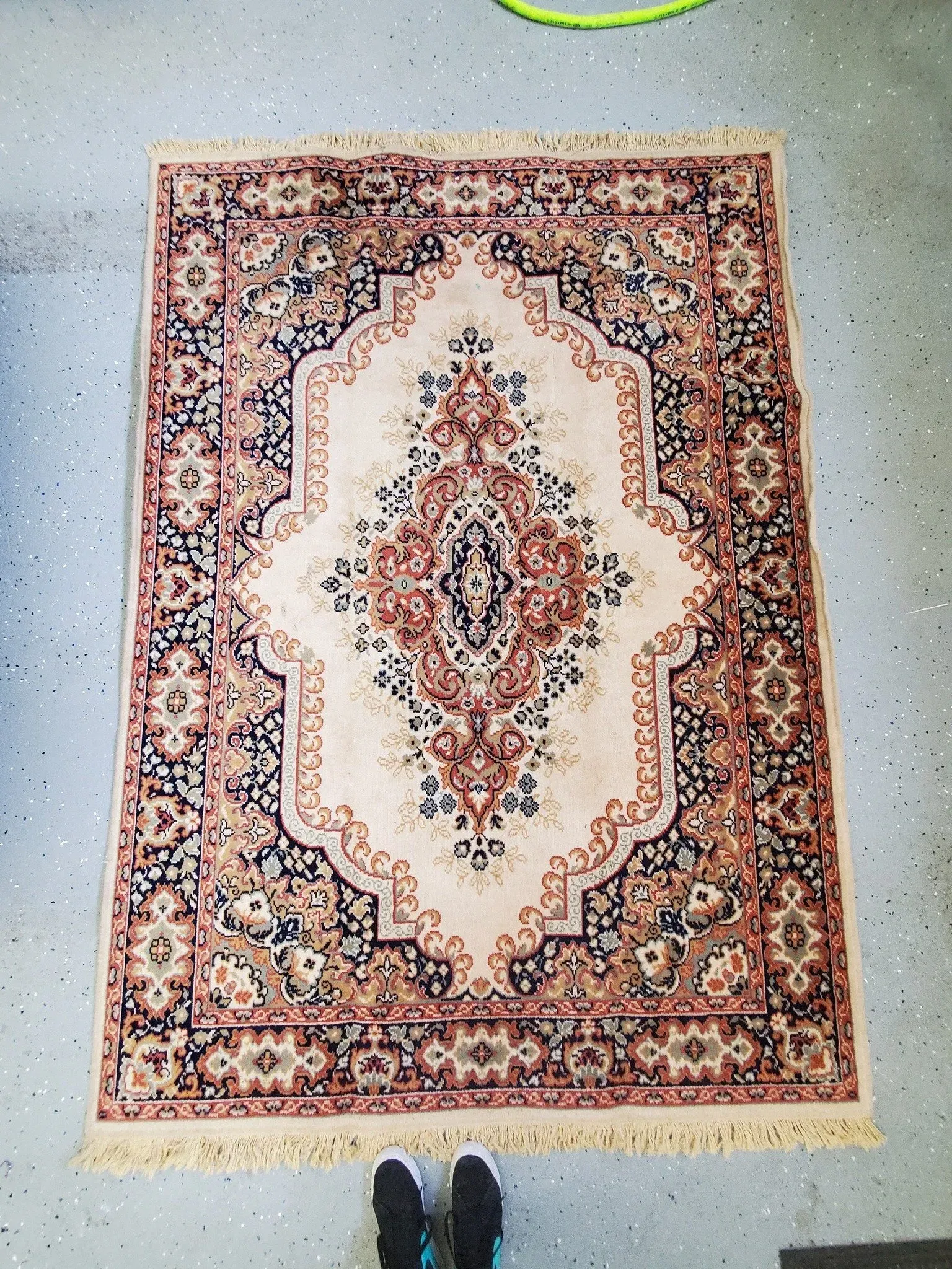 A rug with a floral pattern is on the floor