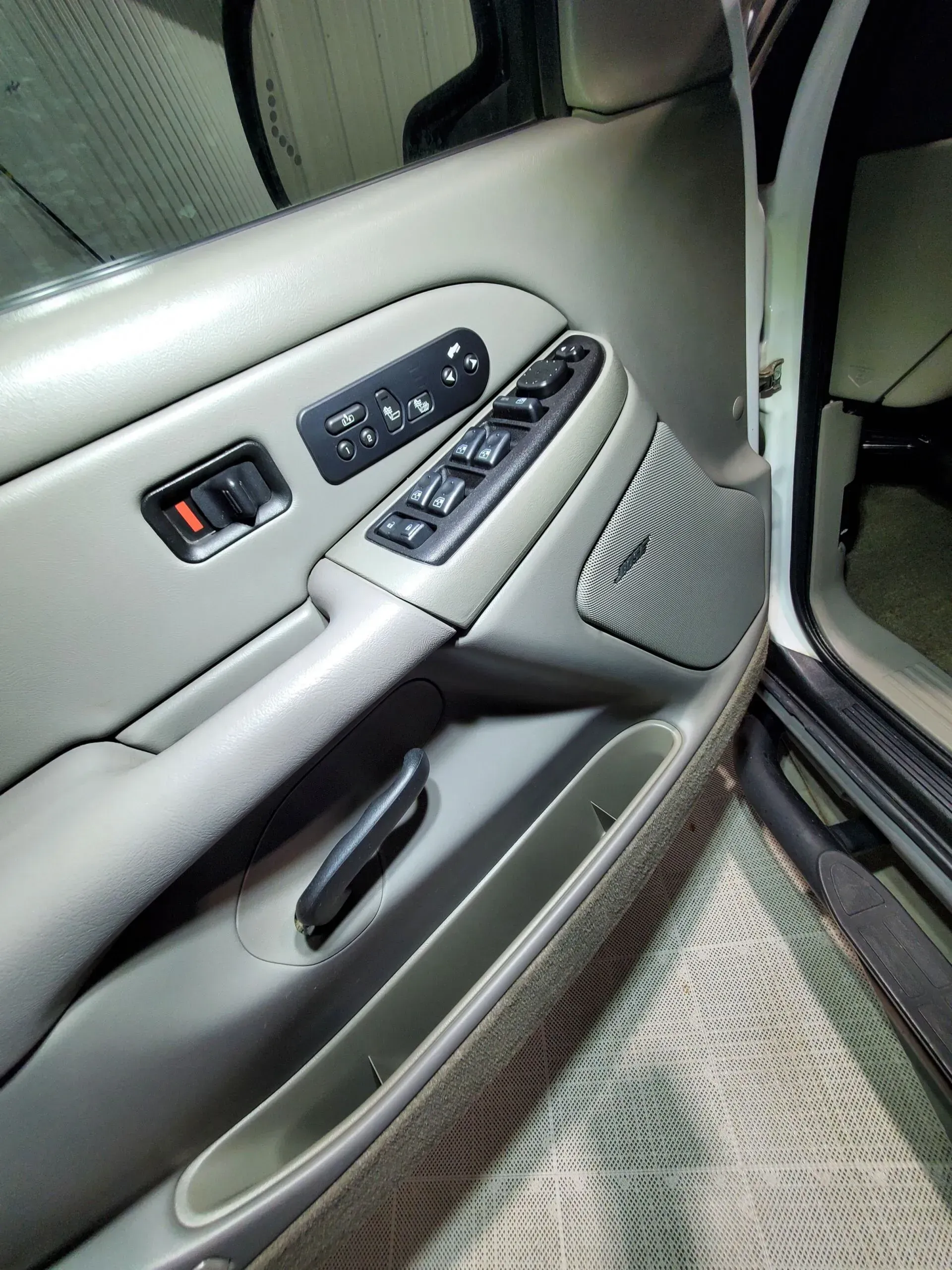 A close up of a car door with the door open