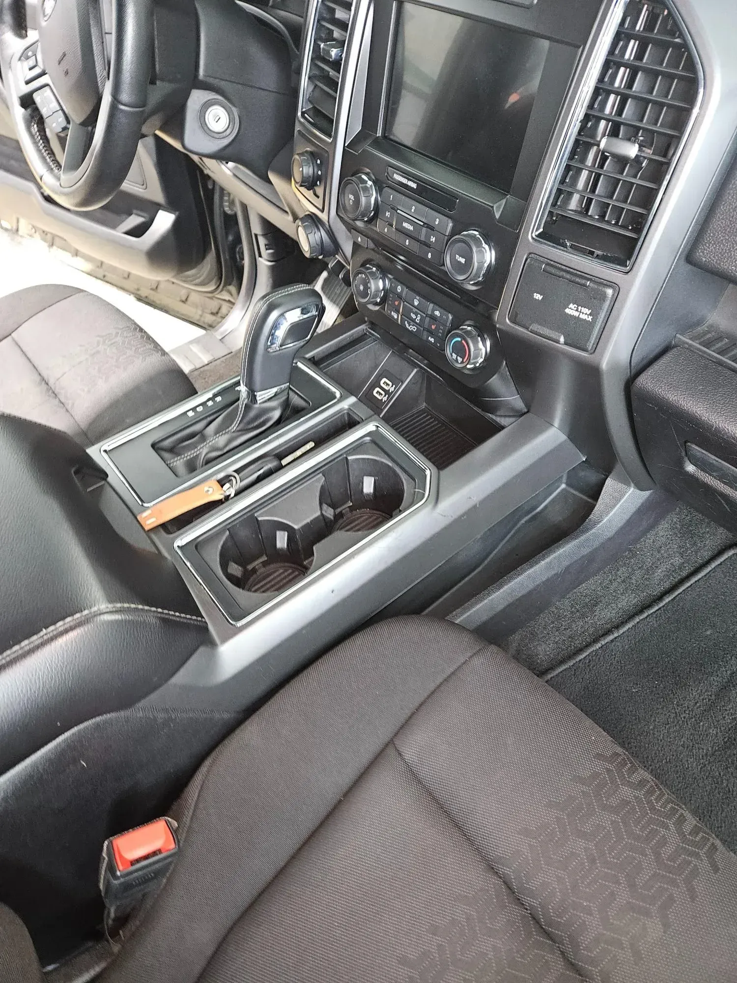 A close up of the interior of a ford f150 truck.