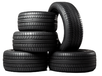 Pile of black car tires, one mounted on a silver rim. | Good Guys Auto Care & Tires