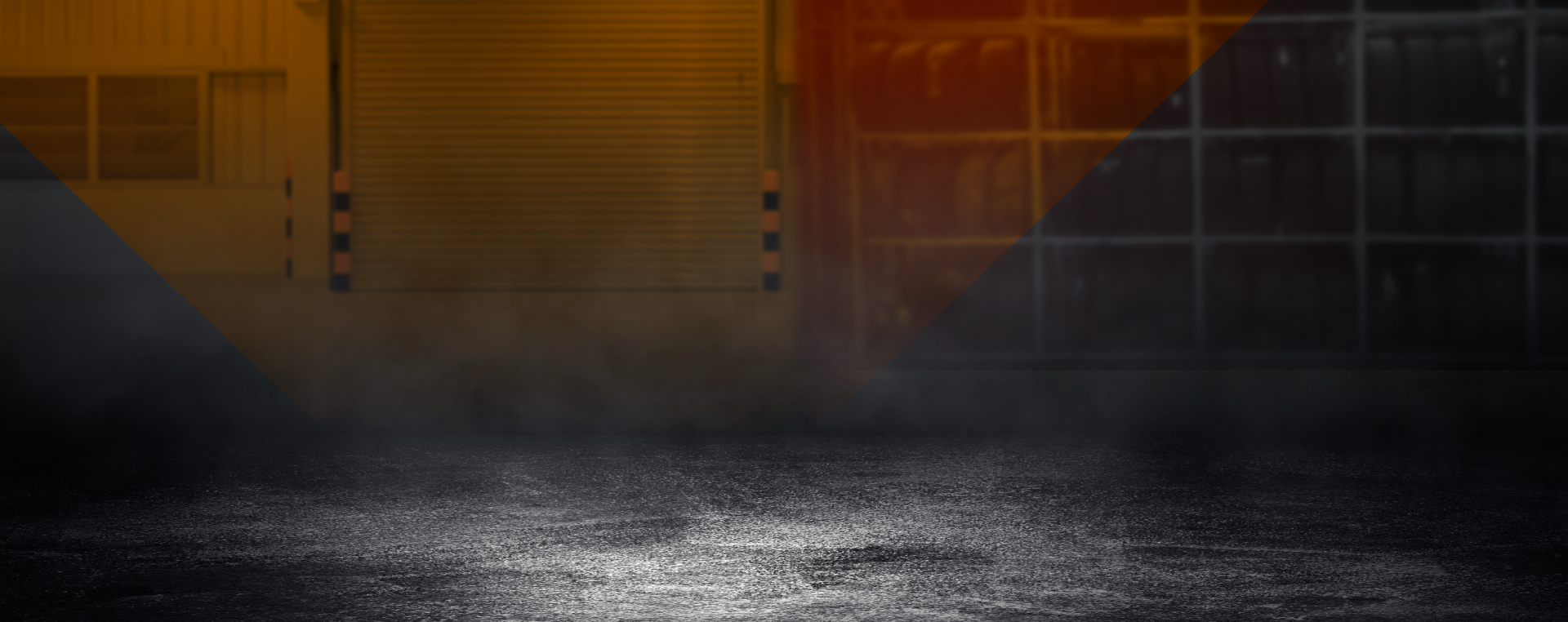Dark asphalt floor with fog in front of a red, black, and white industrial background.