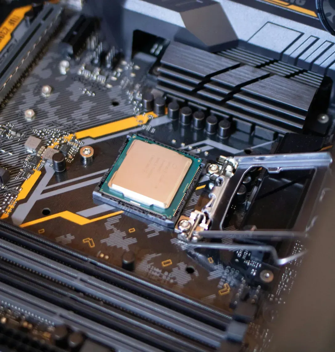 A close up of a motherboard with a cpu on it.