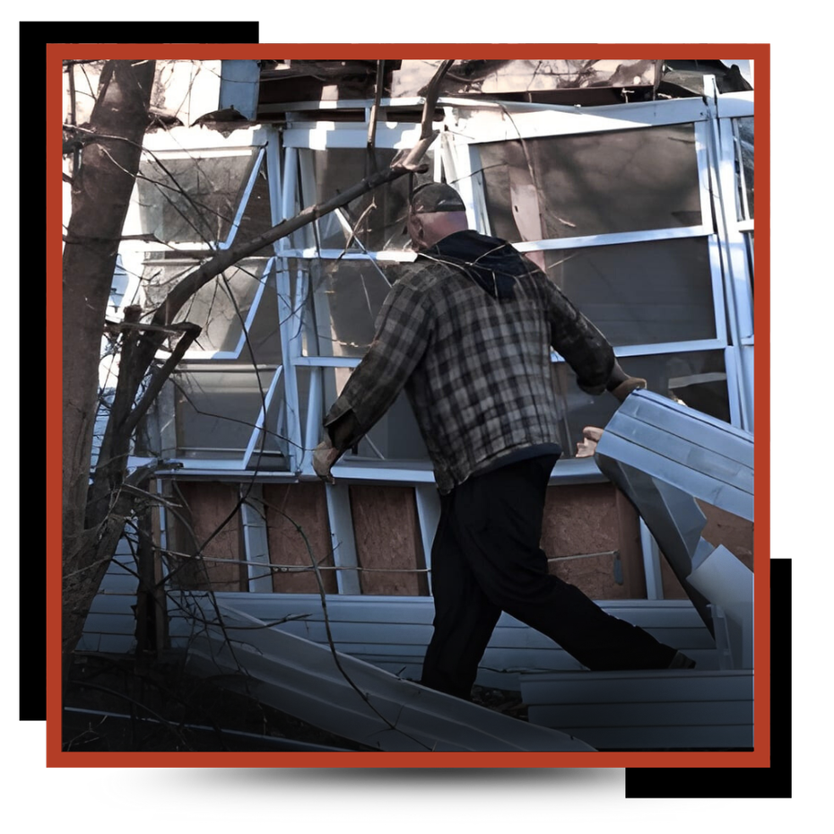 a garbage man piling the junk 