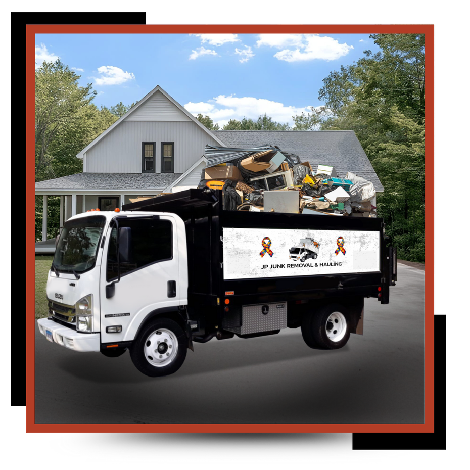 JP Junk removal & hauling truck parked in front of a house