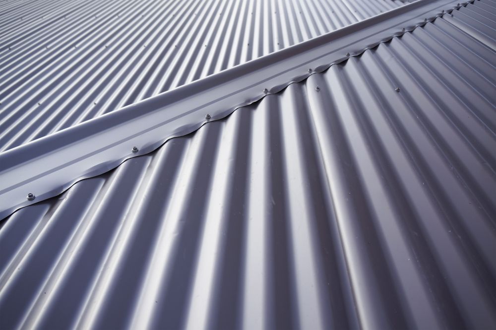 A Close Up of a Metal Roof With a Diagonal Pattern — Apex Roofing Group in Alstonville, NSW
