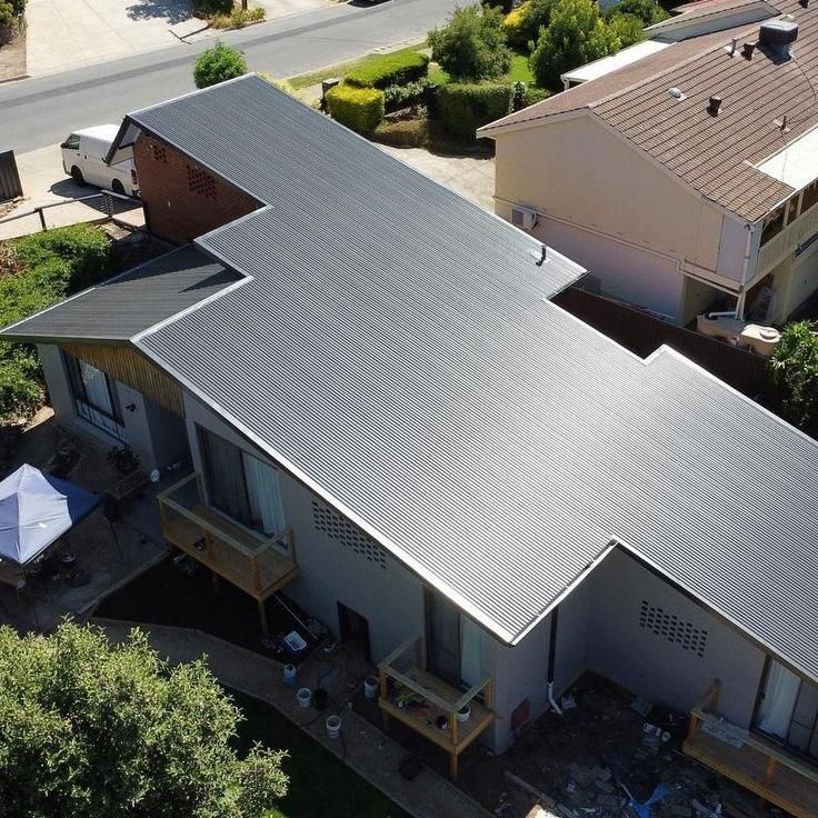 An Aerial View of A House with A Black Roof — Apex Roofing Group in Mullumbimby, NSW