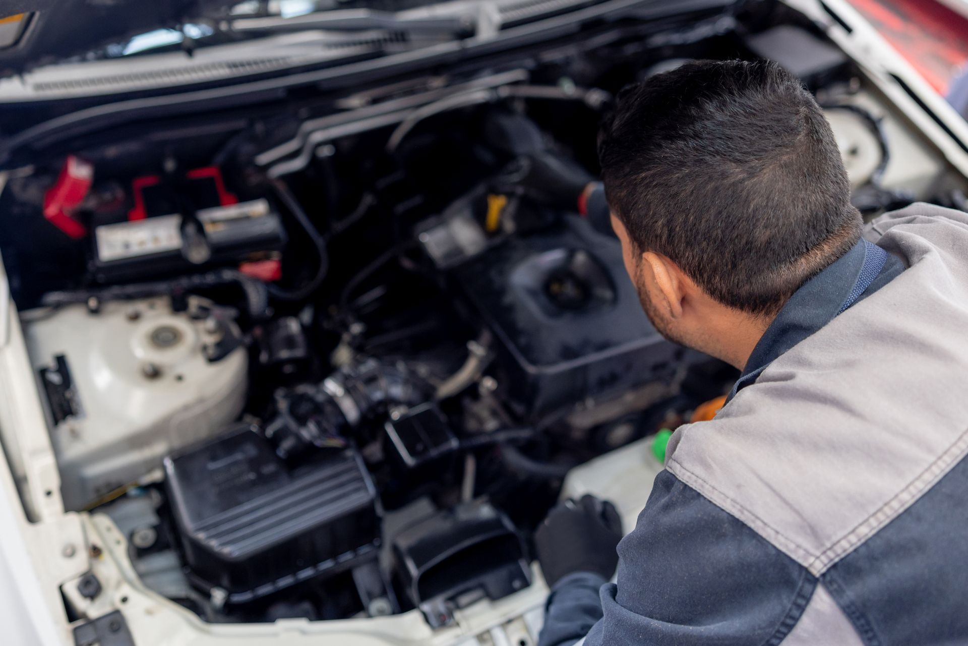 Mechanic Performing Car Transmission Repair at Auto Shop, Vehicle Maintenance, Professional Mechanic