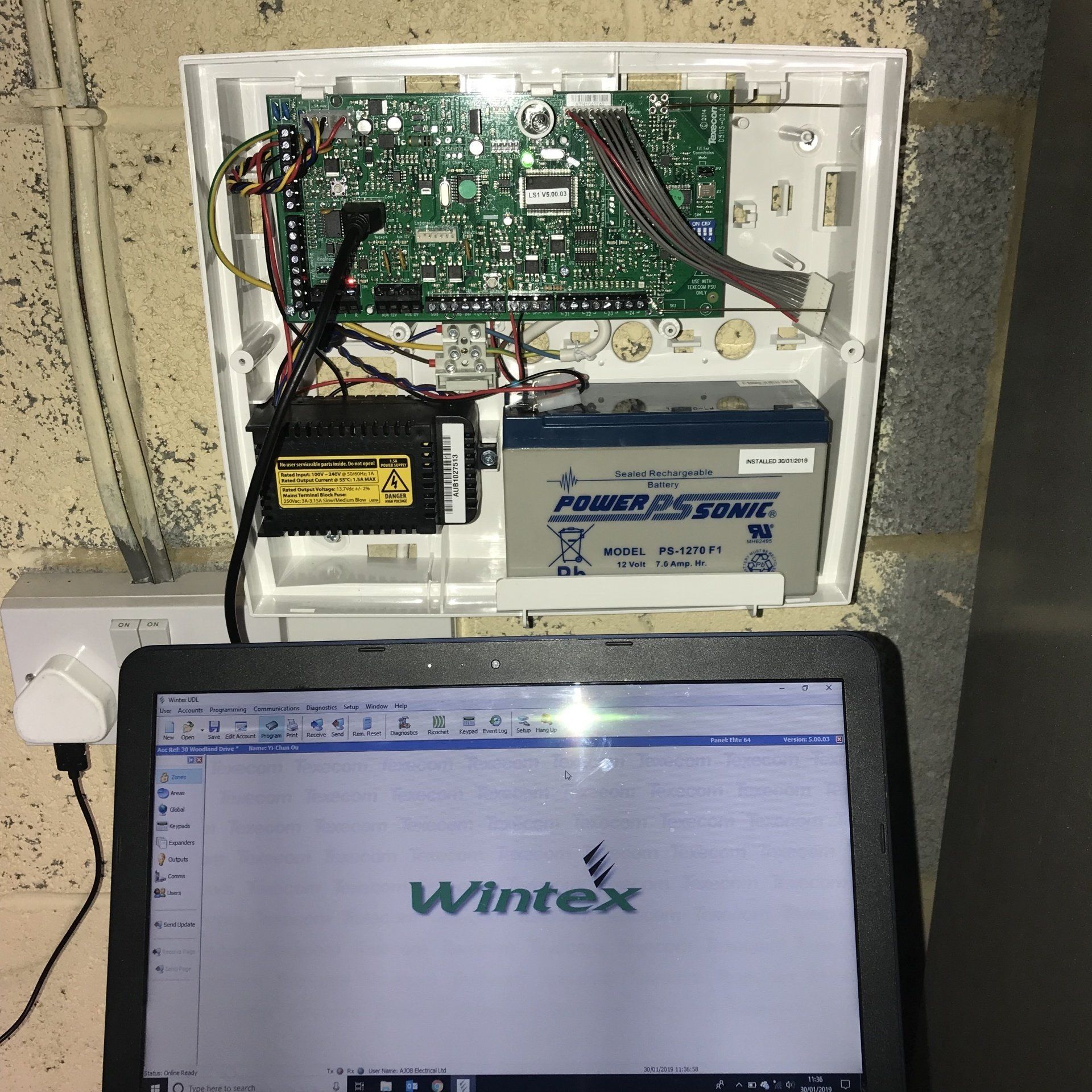 Image of an intruder alarm being serviced