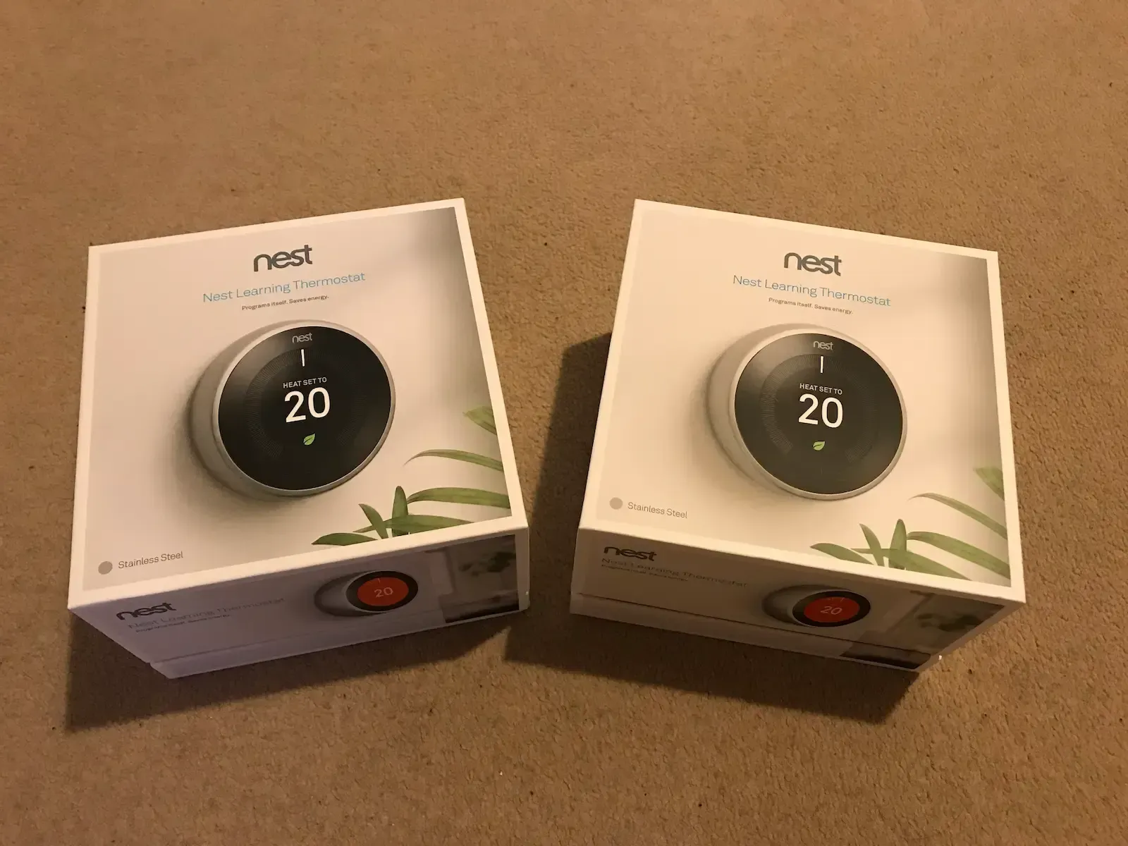 AJOB Electrical Ltd van is parked next to a car that is being charged.