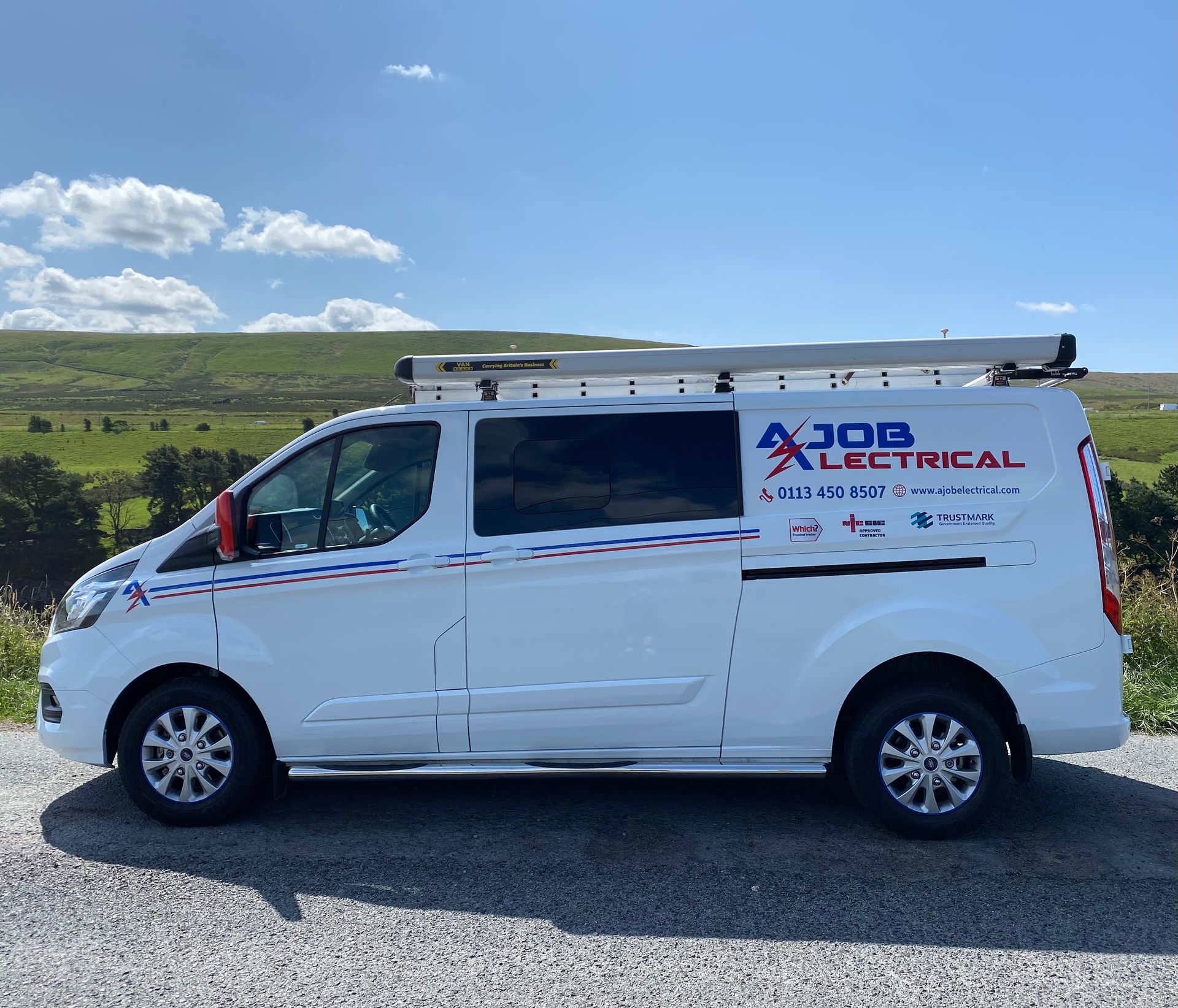 AJOB electrical van is parked in a parking lot