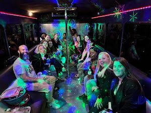 the inside of a limousine with a couch and a pole .