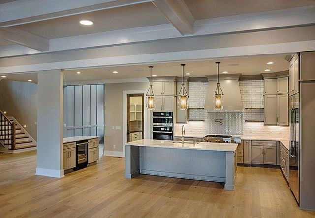 There is a large island in the middle of the kitchen.