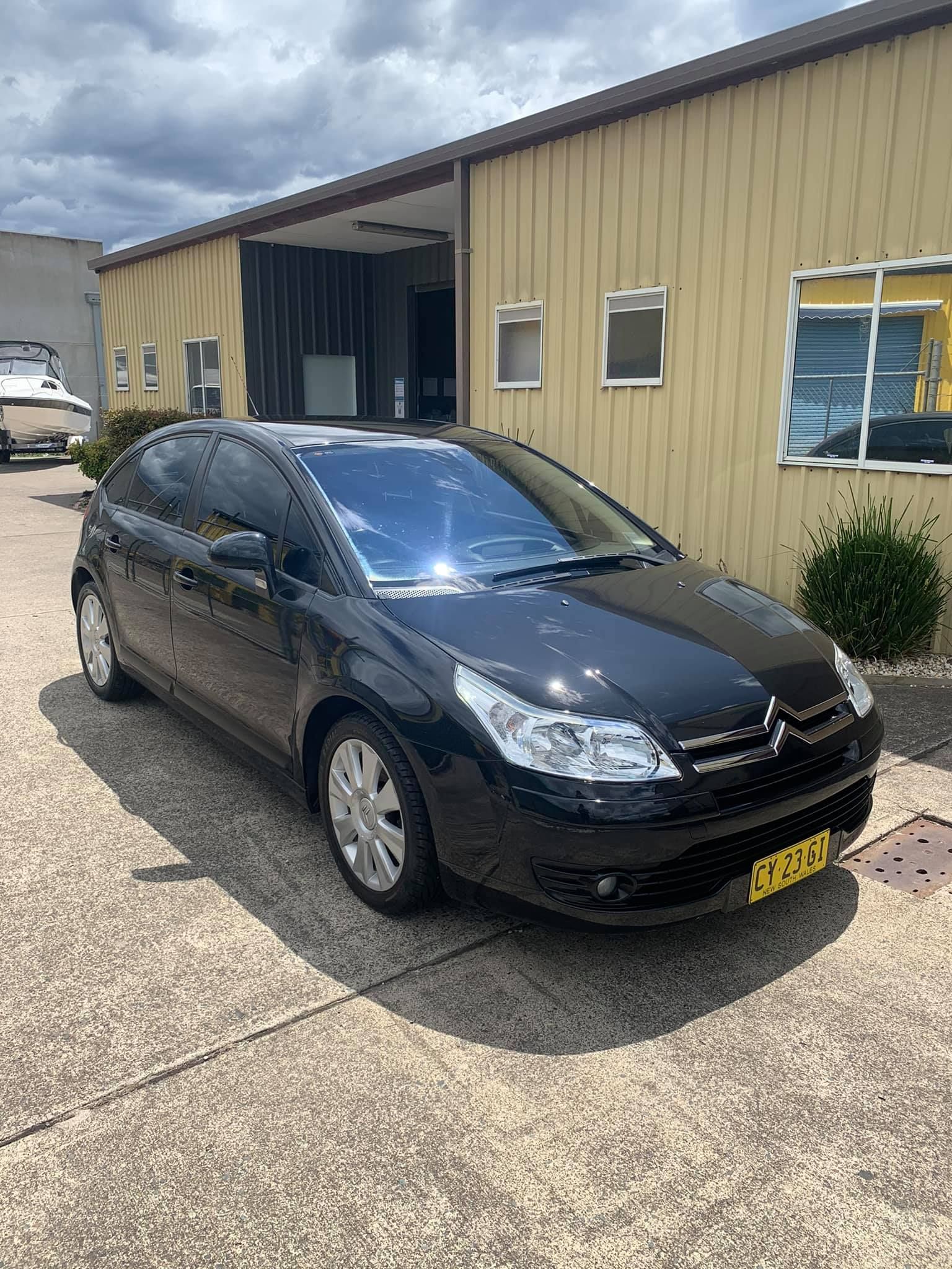Black Citroen C4 Parked in Front of a Tan Building on a Sunny Day — Adettra in Tuncurry, NSW
