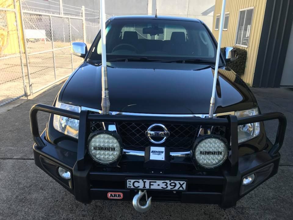 A Man is Polishing the Fender of a Car With a Sponge — Adettra in Tuncurry, NSW