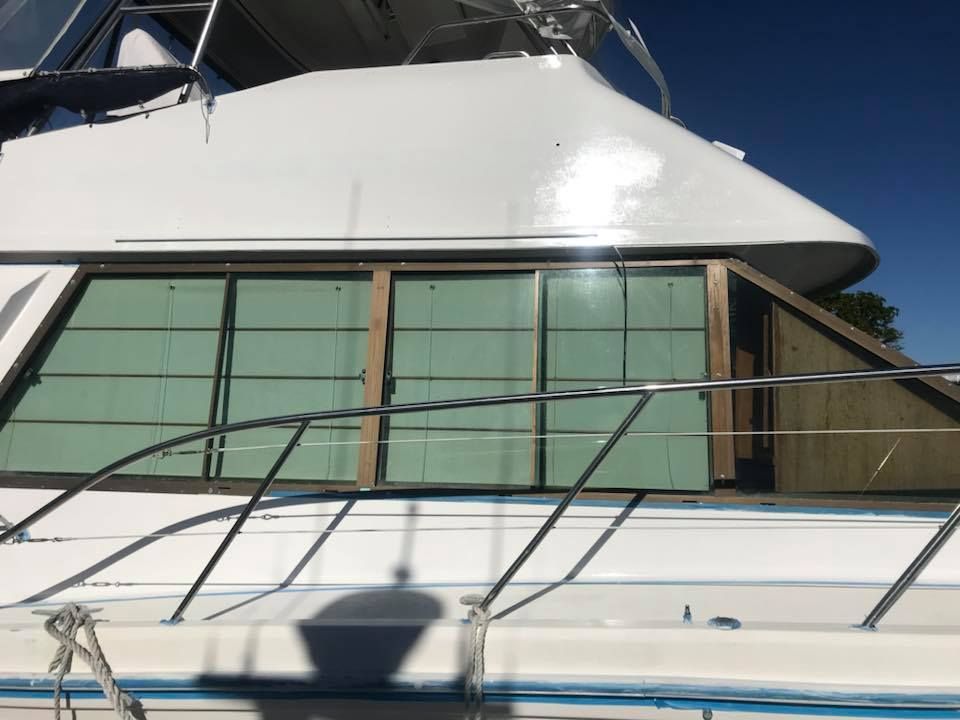 Two Men Detailing the Boat — Adettra in Tuncurry, NSW