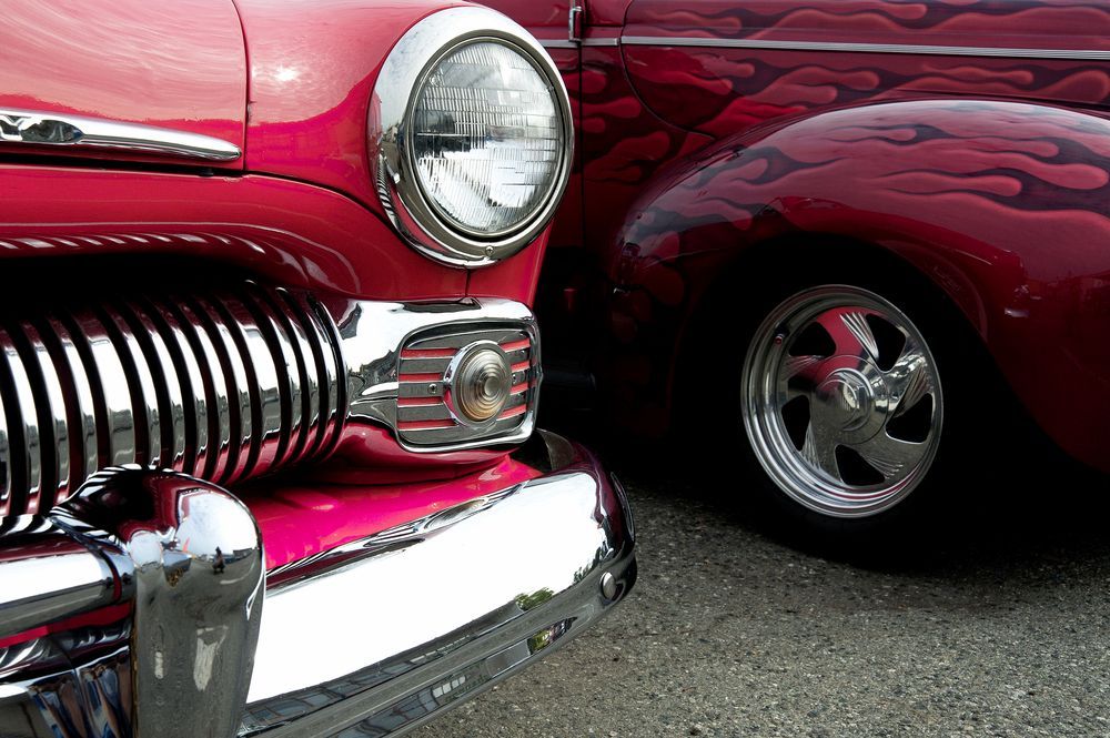 A Bumper of a Red Car is Parked Next to a Purple Car — Adettra in Tuncurry, NSW
