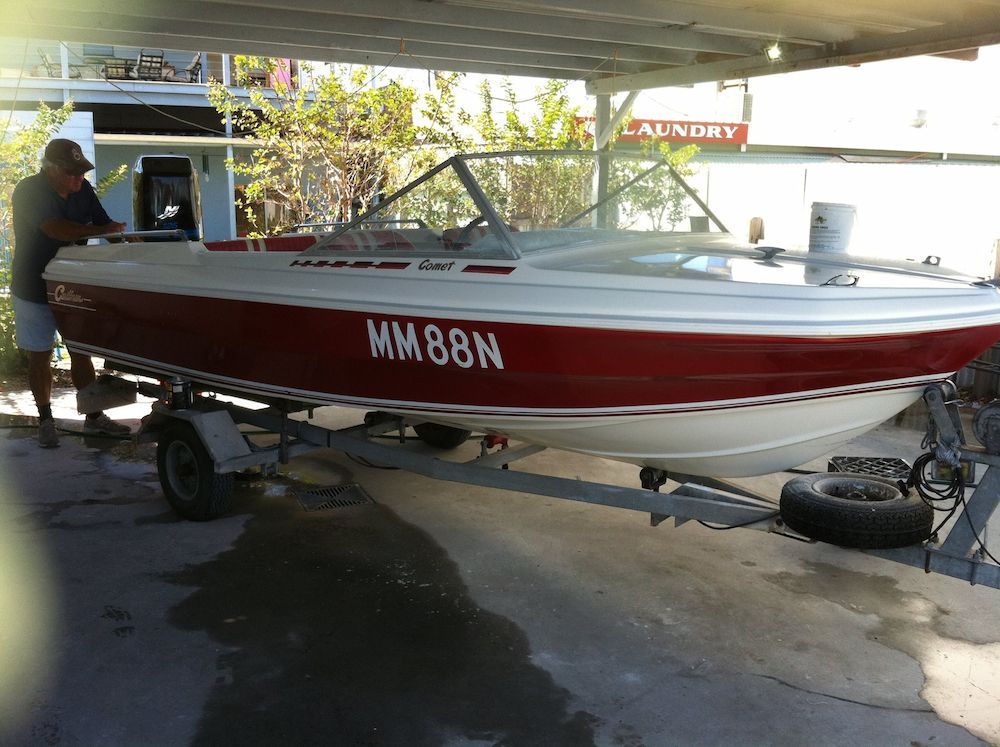 The Man Detailing the White and Red Boat — Adettra in Tuncurry, NSW