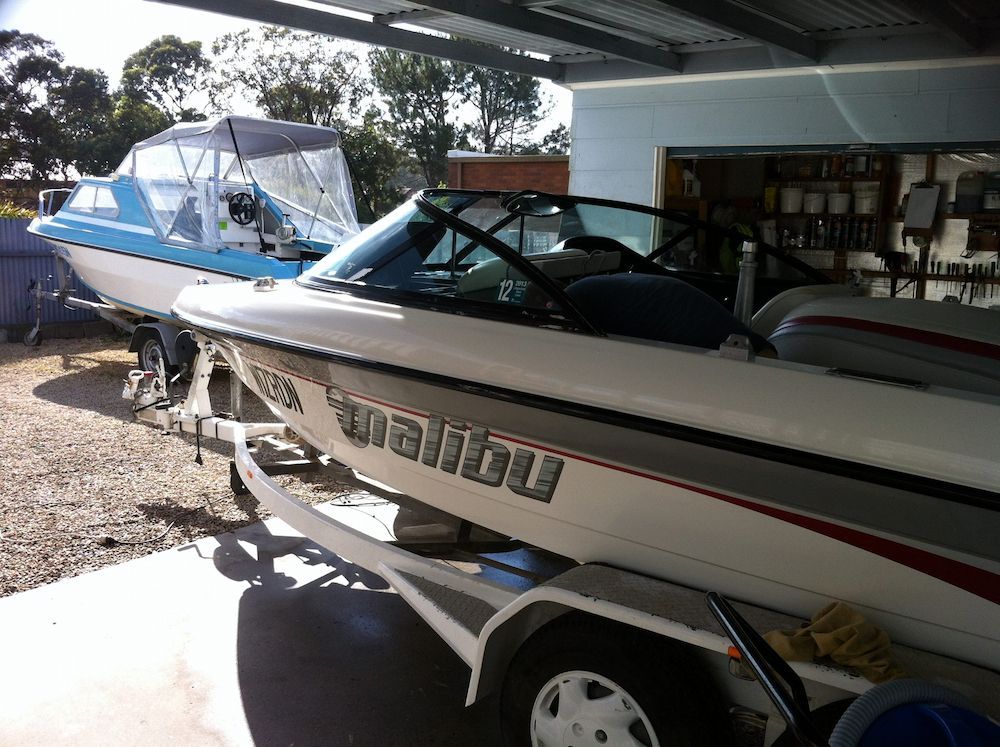 A Malibu Boat is on a Trailer in a Garage — Adettra in Tuncurry, NSW