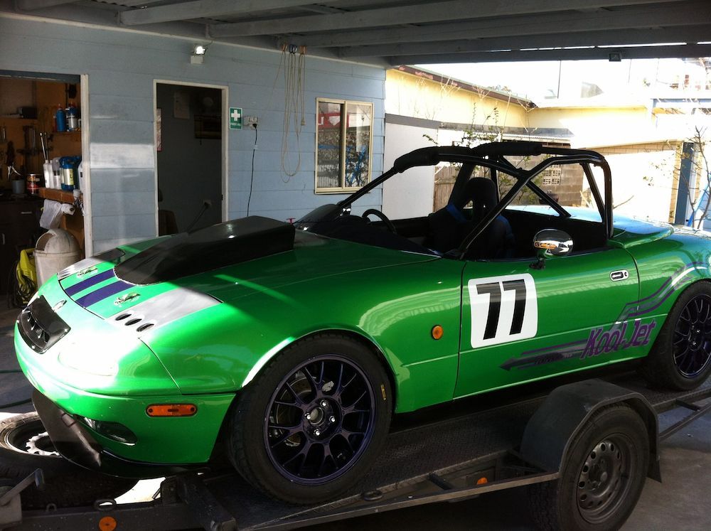 A Green Race Car With the Number 77 on the Side — Adettra in Tuncurry, NSW