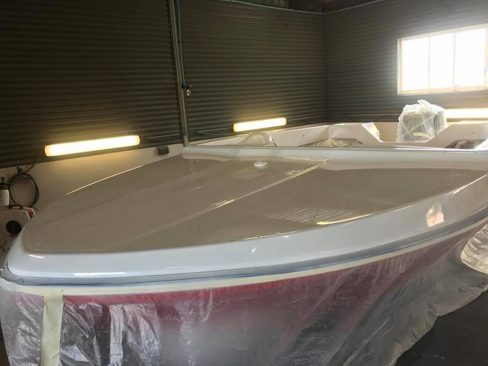 A Boat is Sitting in a Garage Covered in Plastic — Adettra in Tuncurry, NSW