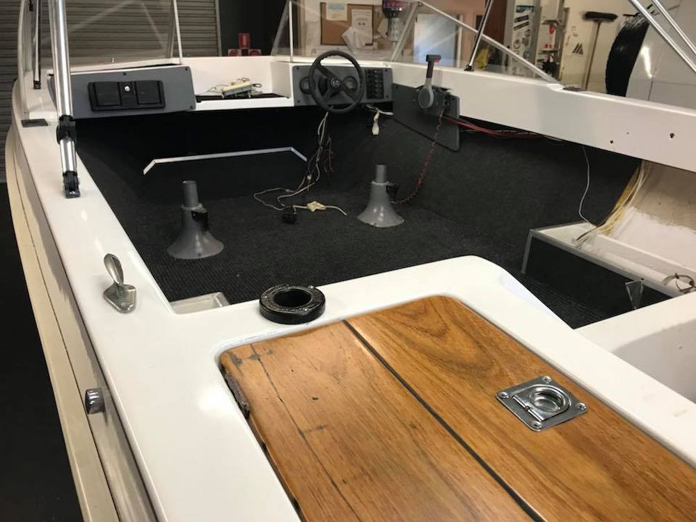 The Inside of a Boat With a Wooden Deck and a Steering Wheel — Adettra in Tuncurry, NSW